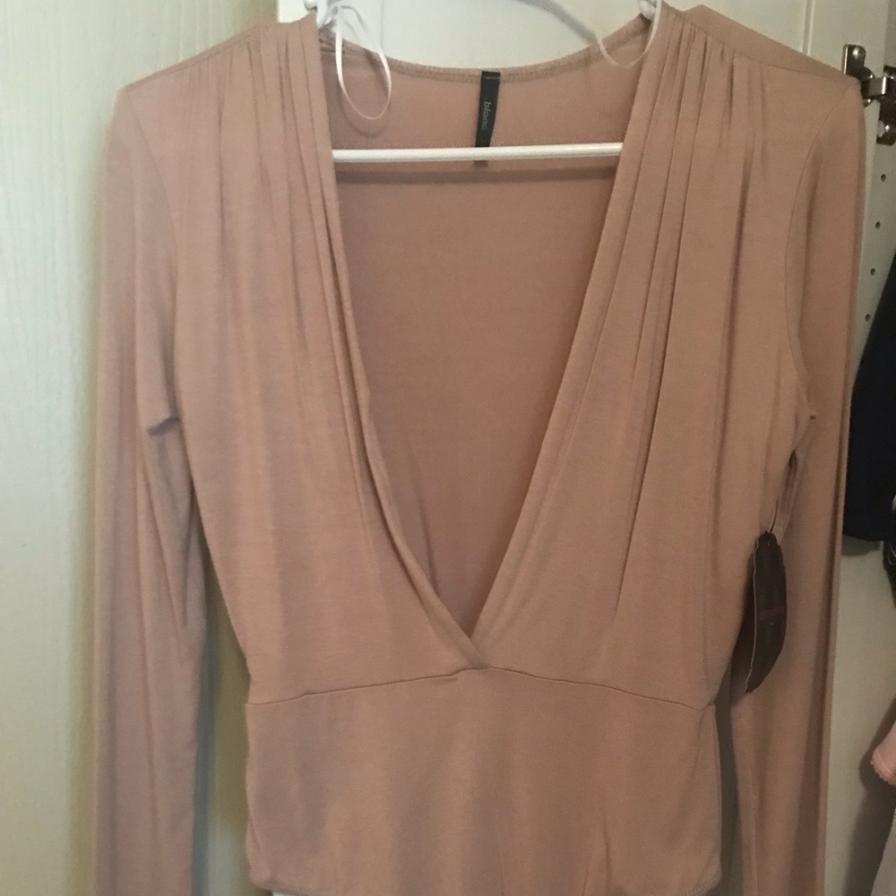 New never worn , deep v nude bodysuit